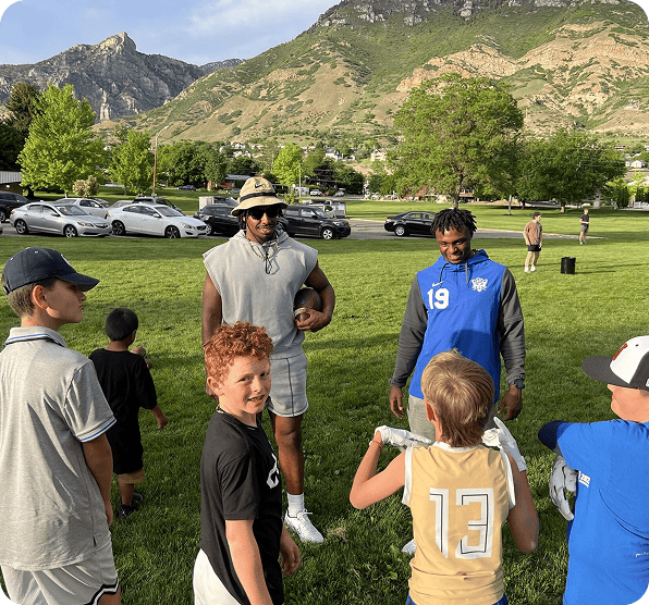BYU athletes with young fans at a CougConnect event